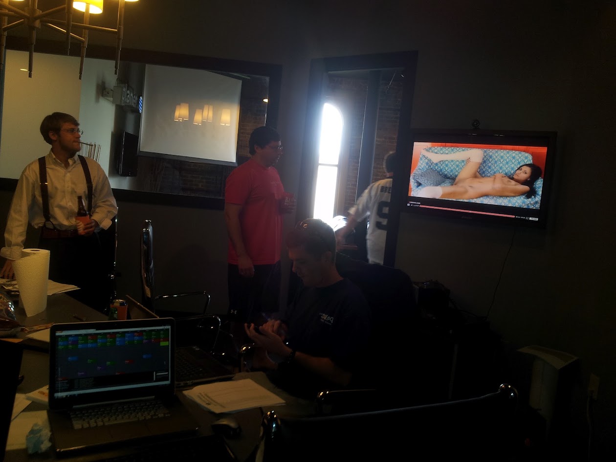 HFFL owners running the 2012 draft from laptops beside the physical board