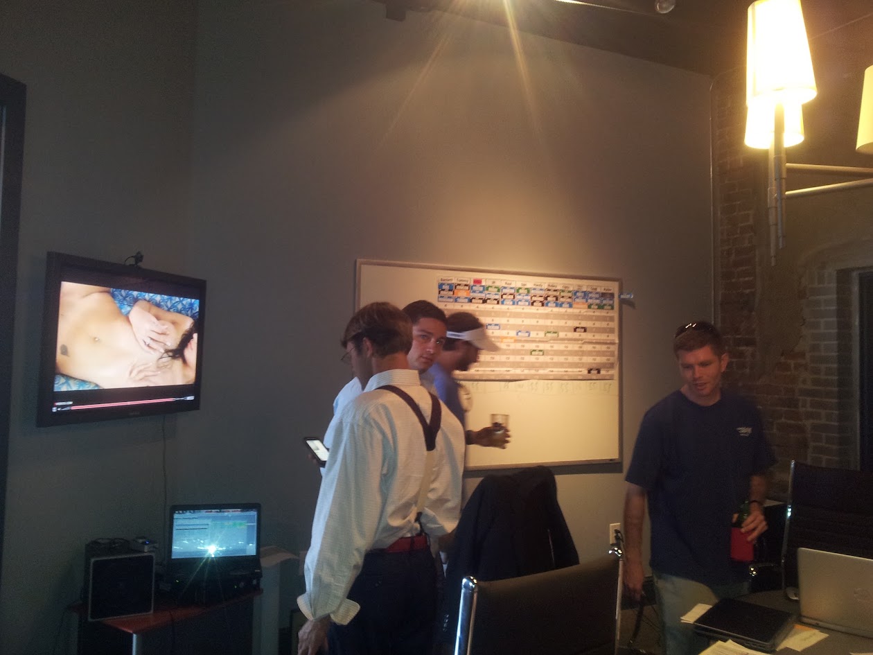 Four HFFL owners gathered beside the physical draft board in 2012